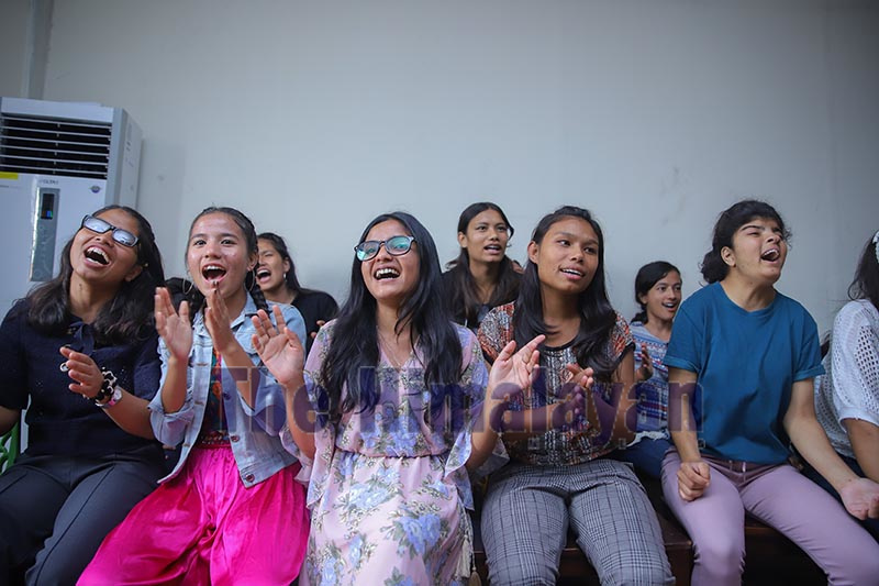 Students cheering performers at a programme to celebrate National Childrenu2019s Day at a local school, in Kathmandu, on Sunday. Childrenu2019s day this year was celebrated with the theme u2018Guarantee of Child Right: Base of Prosperous Nepal.u2019 Photo: Nishant S. Gurung / THT