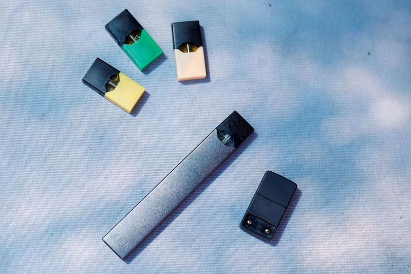 FILE PHOTO: A Juul e-cigarette and pods are seen in this picture illustration taken September 16, 2018. Photo: Reuters