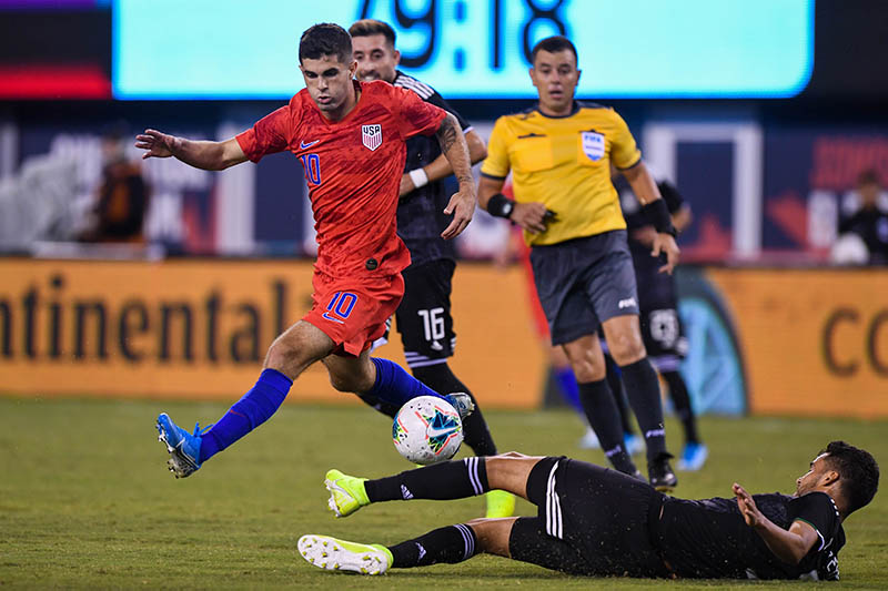 Mexico defender Diego Reyes (5) tries to slide tackle United States midfielder Christian Pulisic (10) during the second half during an international friendly soccer match at MetLife Stadium, in East Rutherford, NJ, USA, on Sep 6, 2019. Photo: Dennis Schneidler-USA TODAY Sports via Reuters