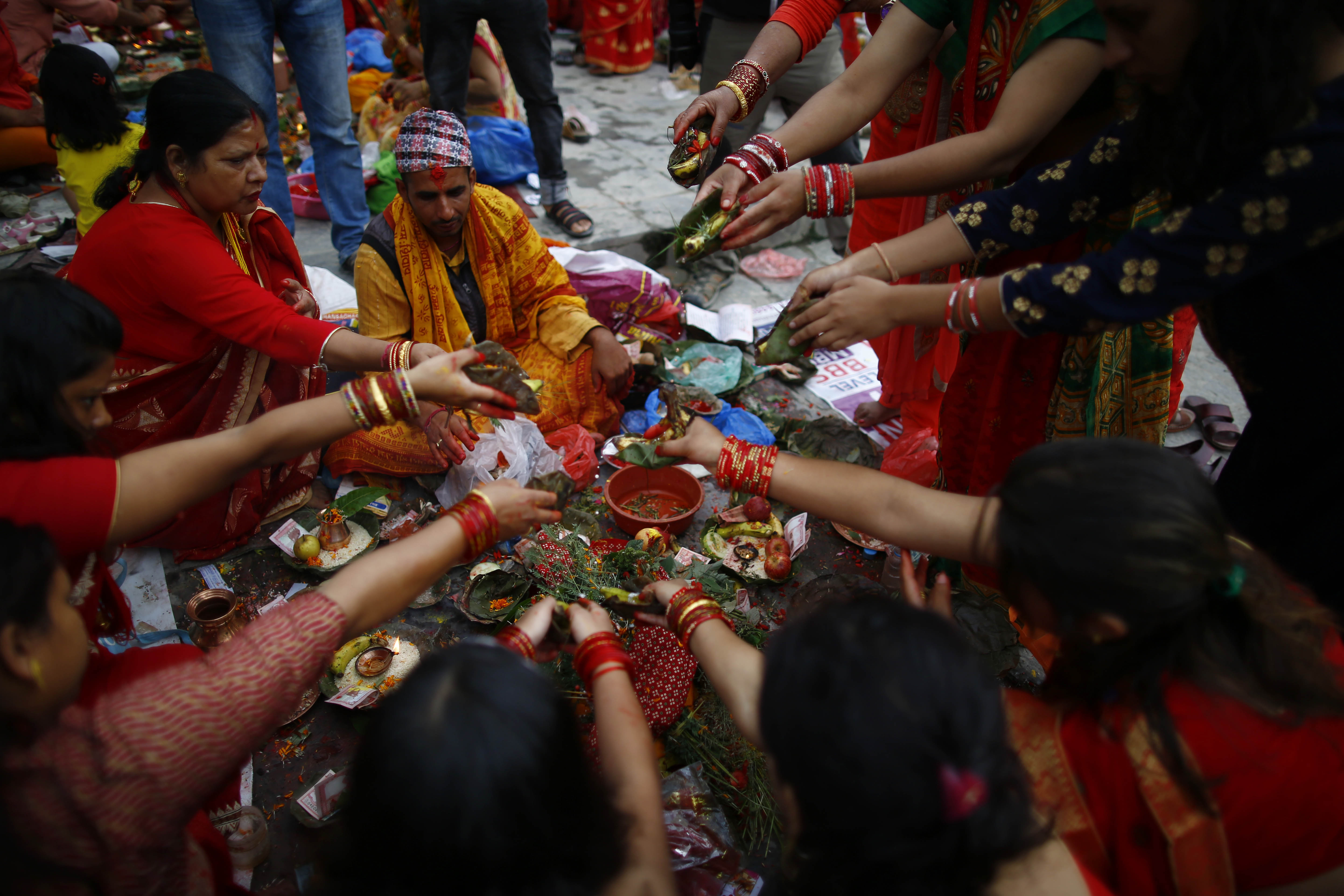 Hindu women perform ritual prayers during Rishi Panchami festival, on the banks of Bagmati River, in Kathmandu, on Tuesday, September 3, 2019. Photo: Skanda Gautam/THT