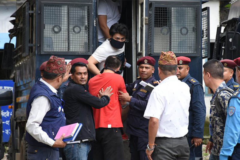 The suspects being arrested on the charge of stealing money from ATM booth in Kathmandu, on Saturday, August 31, 2019. Courtesy: MPR