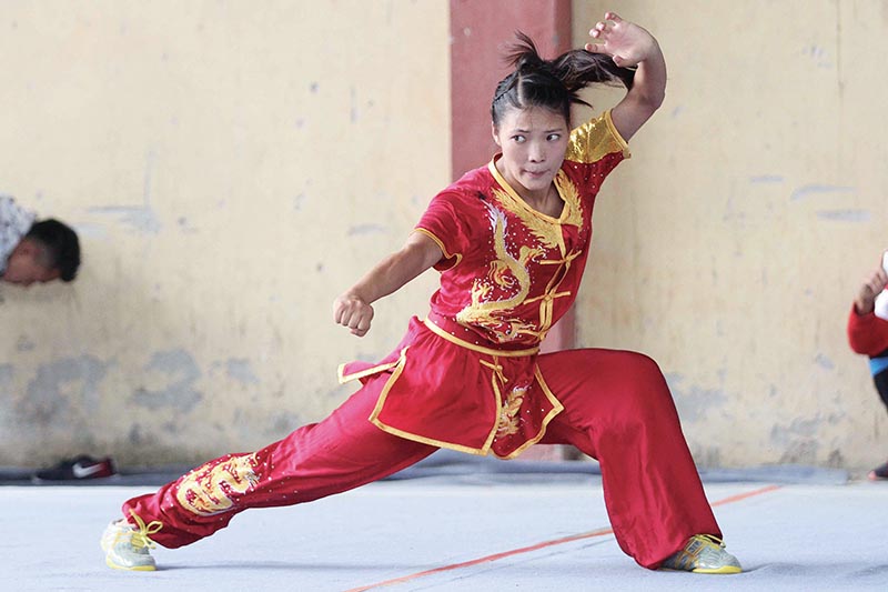 Tribhuvan Army Club wushuka Nima Gharti Magar performs during the selection tournament at the Olympian semi covered hall in Kathmandu on Saturday. Photo: Udipt Sing Chhetry/ THT