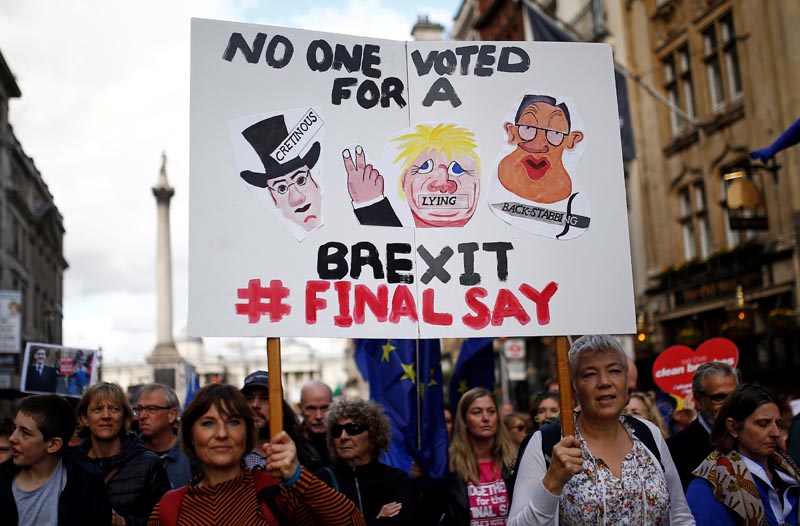EU supporters hold a banner during a march as parliament sits on a Saturday for the first time since the 1982 Falklands War, to discuss Brexit in London, Britain, October 19, 2019. Photo: Reuters