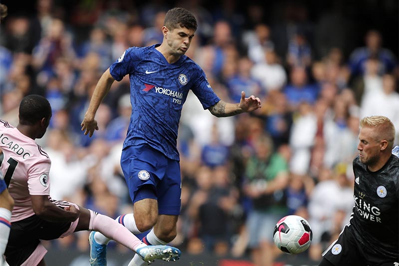 FILE - Chelsea's Christian Pulisic (centre) vies for the ball with Leicester's Ricardo Pereira (left) in front of Leicester's goalkeeper Kasper Schmeiche (right) during the English Premier League soccer match between Chelsea and Leicester City at Stamford Bridge stadium in London, on Sunday, August 18, 2019. Photo: AP