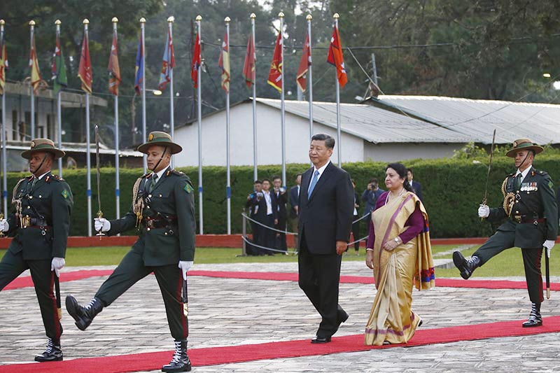 President of the Peopleu2019s Republic of China, Xi Jinping (centre) welcomed by his Nepali counterpart Bidya Devi Bhandari, receives a guard of honour upon his arrival at Tribhuvan International Airport, Kathmandu, on Saturday, October 12, 2019. The Chinese President is on a two-day state visit to Nepal at the invitation of his Nepalese counterpart Bhandari. This is the visit of a Chinese President to Nepal in the gap of 23 years.