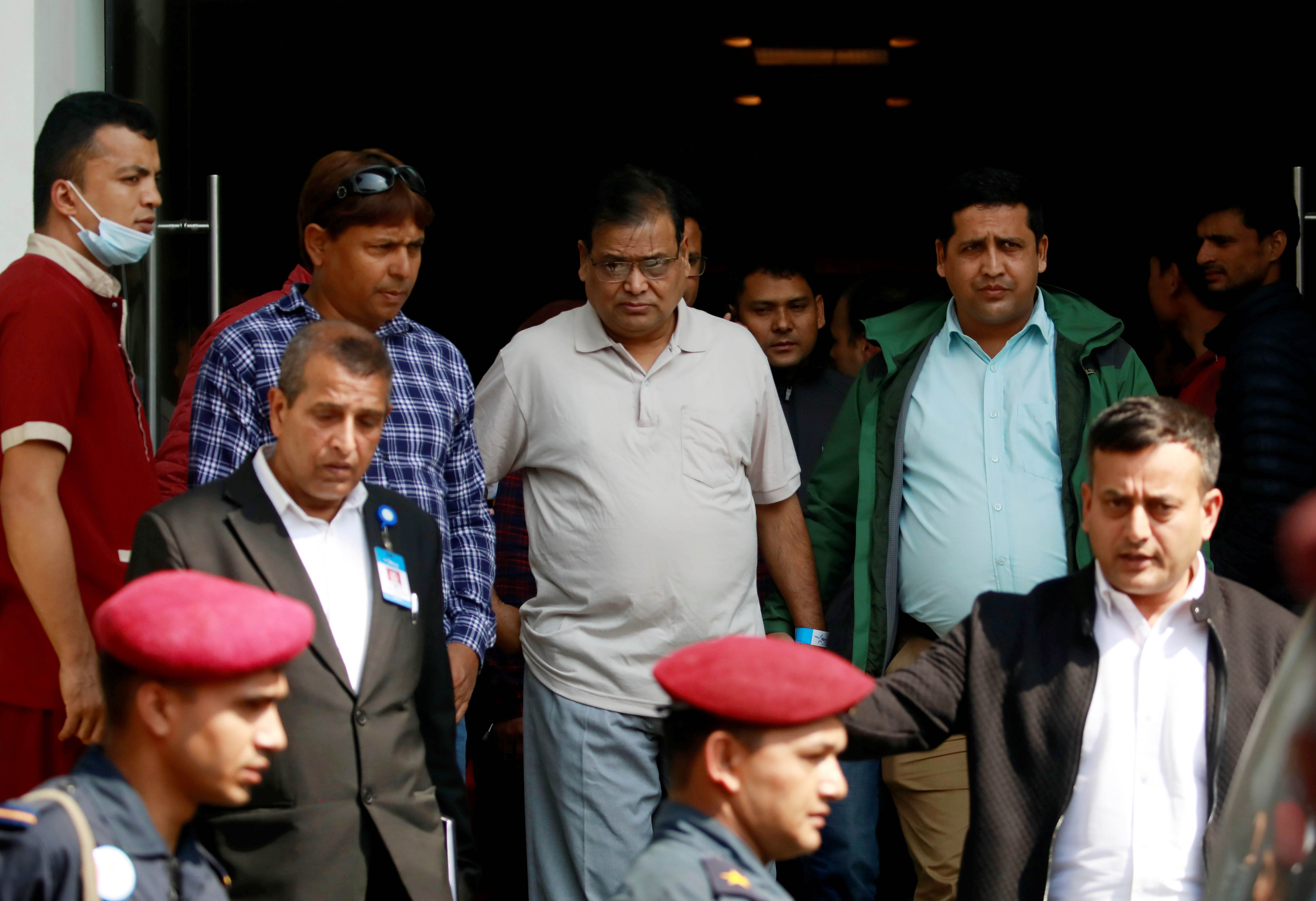 Krishna Bahadur Mahara (C) who resigned from his post as a speaker of the House of Representatives in Nepal's parliament after an accusation made by a female parliament employee that he raped her, heads towards the court in Kathmandu, Nepal October 15, 2019. Photo: Reuters