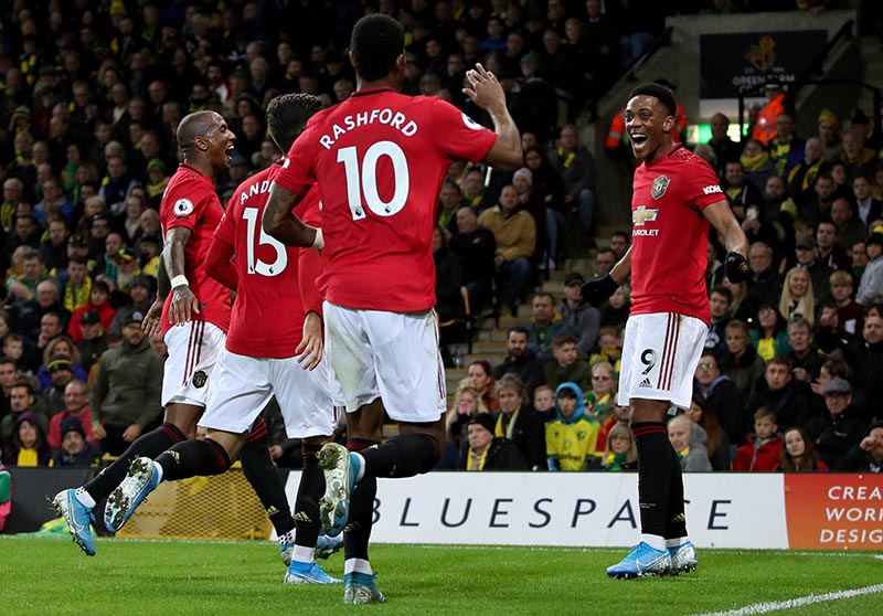 Manchester United's Anthony Martial celebrates scoring their third goal with team mates during the  Premier League match between Norwich City and Manchester United, at Carrow Road, in Norwich, Britain, on October 27, 2019. Photo: Reuters