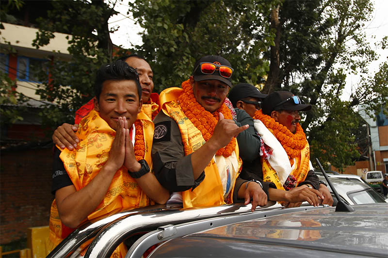 Nirmal 'Nims' Purja (36) along with his team of Project Possible gesture upon their arrival, after successfully scaling all 14 mountains above 8,000 m in just over six months setting the world record, in Kathmandu, on Wednesday, October 30, 2019. Photo: Skanda Gautam/THT