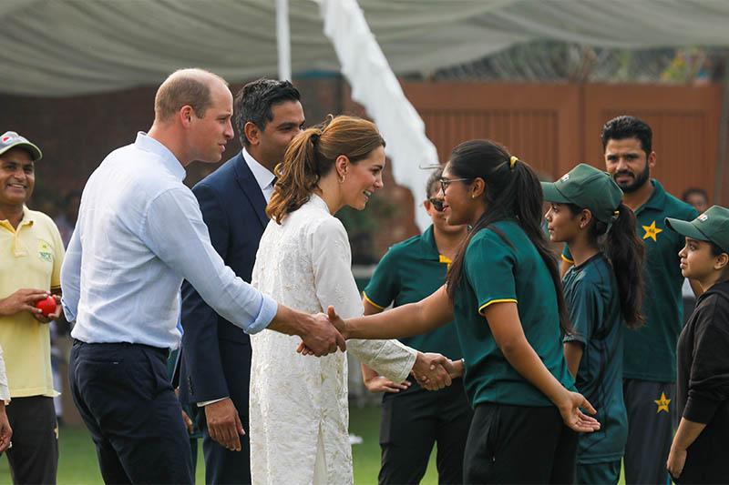 Britain's Prince William and Catherine, Duchess of Cambridge, shake hands with children participants of the British Council's DOSTI (friendship) program at the National Cricket Academy in Lahore, Pakistan October 17, 2019. Photo: Reuters