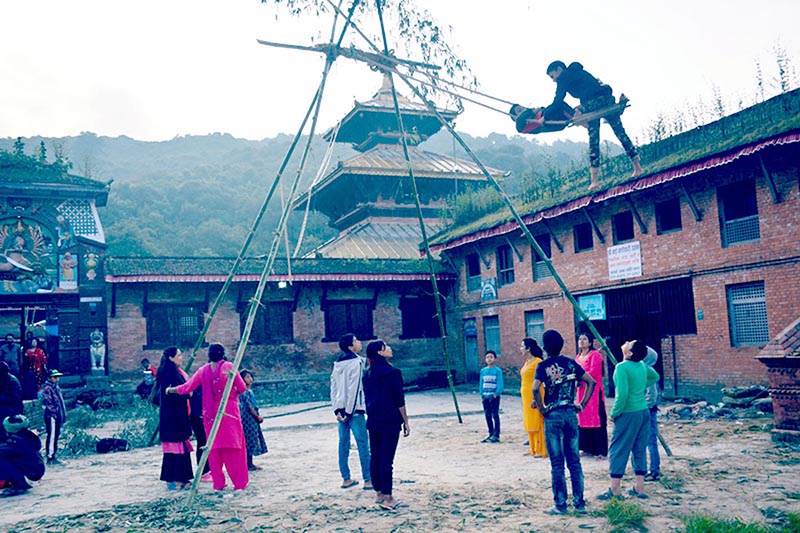 Hindu devotees and revellers swing while others wait in turn, on the occasion of Maha Nawami, ninth day of 10-day-long Bada Dashain festival, on the premises of Chandeshwari temple, in Banepa Municipality-5, Kavrepalanchok district, on Monday, October 7, 2019. Photo: RSS