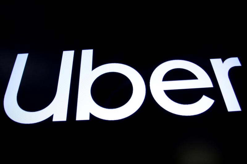 A screen displays the company logo for Uber Technologies Inc on the day of it's IPO at the New York Stock Exchange (NYSE) in New York, US, May 10, 2019. Photo: Reuters/File