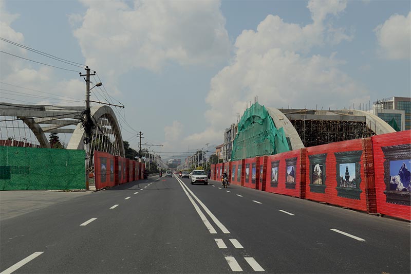 A car passing by the road decorated with signboards by the roadsides to welcome the President of the People's Republic of China, Xi Jinping, along the Araniko Highway, at Babarmahal, on Wednesday, October 9, 2019. Photo: RSS