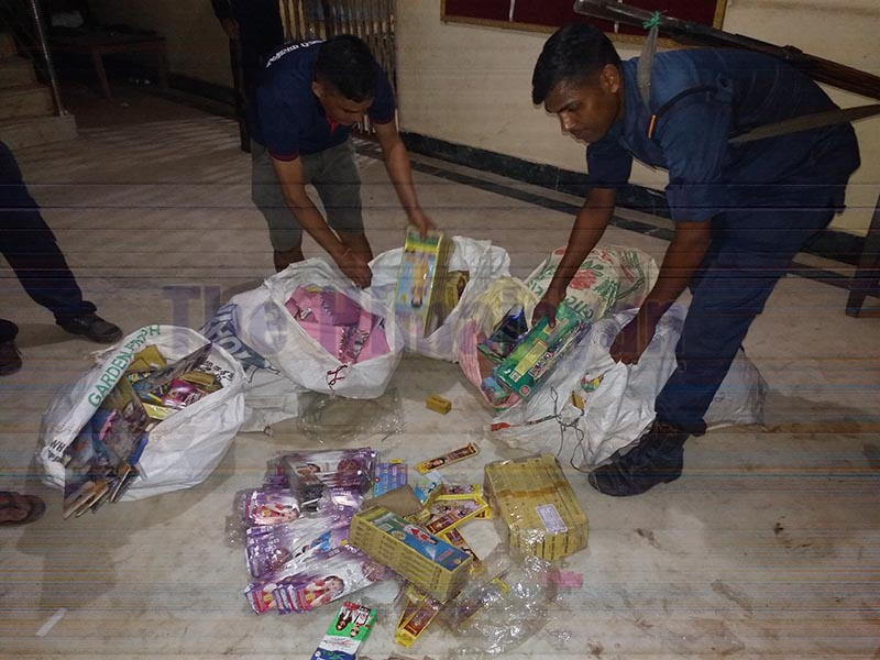 Police personnel checking packages containing contraband fireworks at District Police Office in Saptari district, on Monday, October 20,  2019. Photo: THT