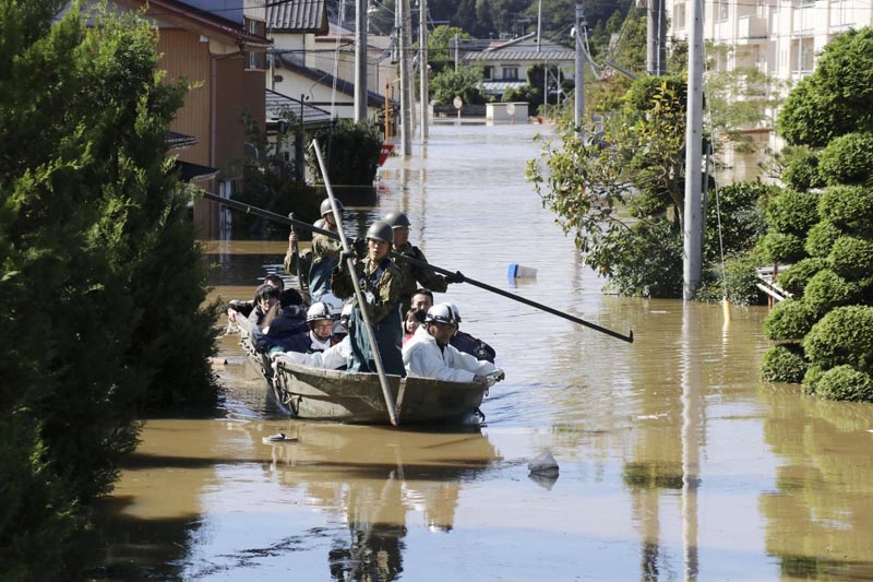 Local residents are rescued by Japapnese Defence-Force soldiers from a flooded area caused by Typhoon Hagibis in Kakuda, Miyagi prefecture, Japan, on October 13, 2019. Photo: Reuters