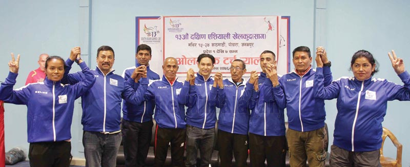 President of Nepal National and International Players Association Deepak Shrestha (centre) and Olympians pose for a group photo during the press meet to announce the 13th South Asian Games Olympic Torch Relay in Kathmandu on Thursday, November 21, 2019. Photo: THT