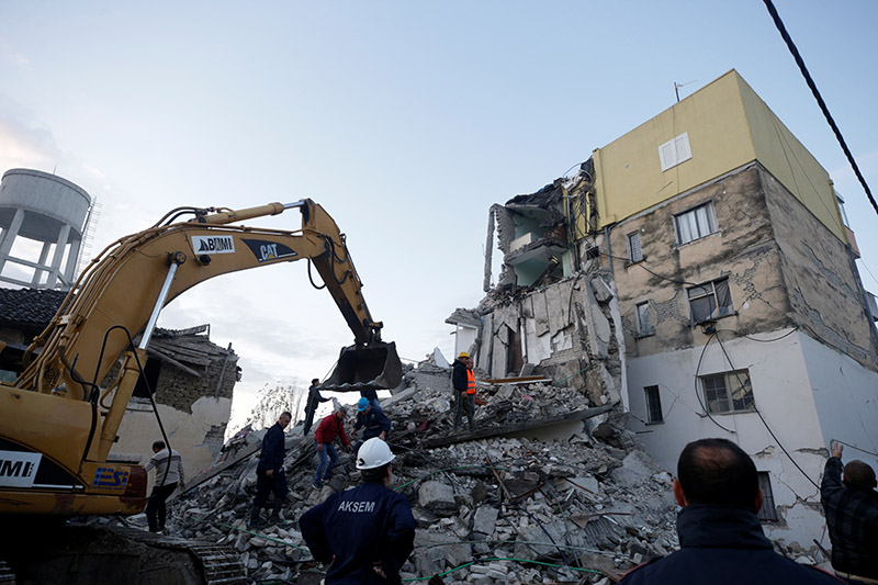 Emergency personnel work near a damaged building in Thumane, after an earthquake shook Albania, on November 26, 2019. Photo: REUTERS