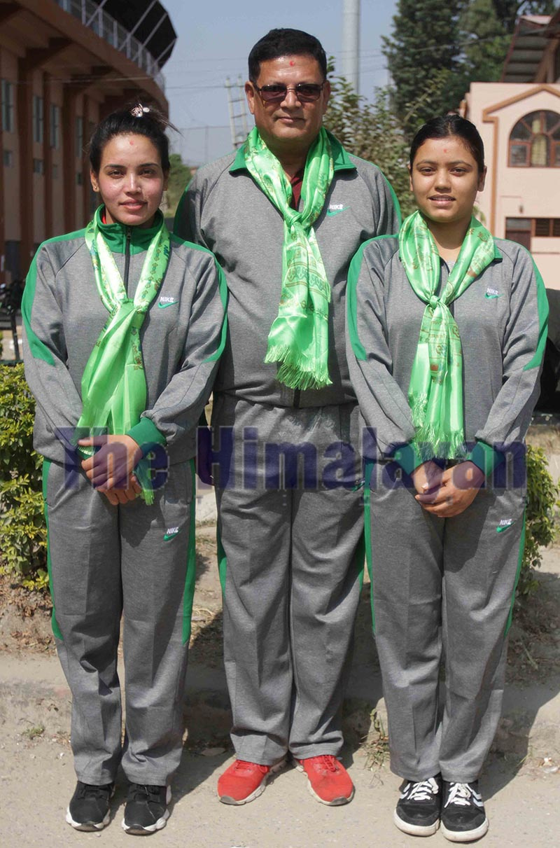 Shooters Kalpana Pariyar (left), Shushmita Nepal (right) and coach Pradip Khati take group photo during their farewell to participate in the 14th Asian Shooting Championship and Tokyo Olympic 2020 Qualifiers in Doha, Qatar at National Sports Council, Tripureshwor in Kathmandu on Saturday. Photo: THT