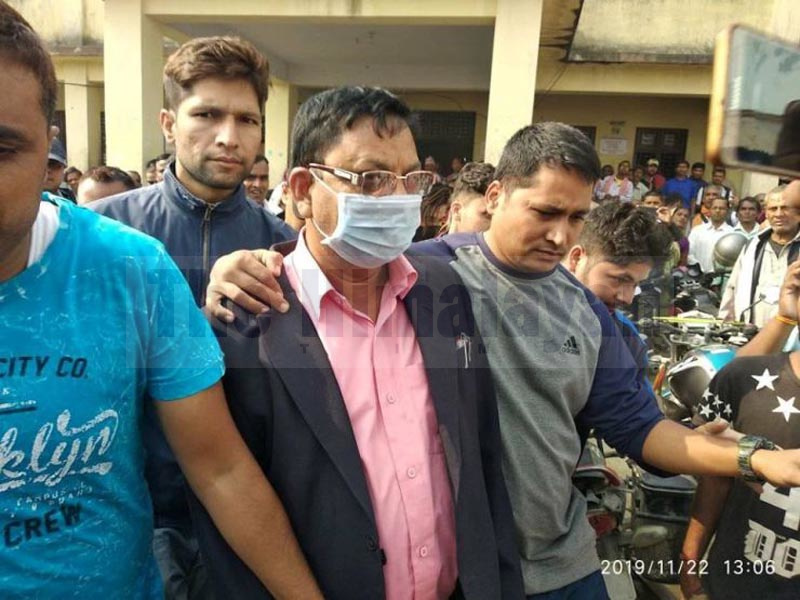 Rambabu Mandal, acting chief land revenue officer at the Land Reform and Revenue Office in Siraha district being taken into custody by CIAA team on bribery charge, on Friday, November 22, 2019. Photo: Aashish BK/THT
