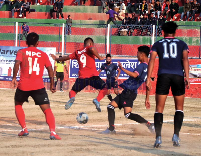 Players of NPC and Jawalakhel Youth Club (right) vie for the ball during their third Chandragiri Mayor Gold Cup Football Tournament match in Naikap on Monday, November 18, 2019. Photo: THT