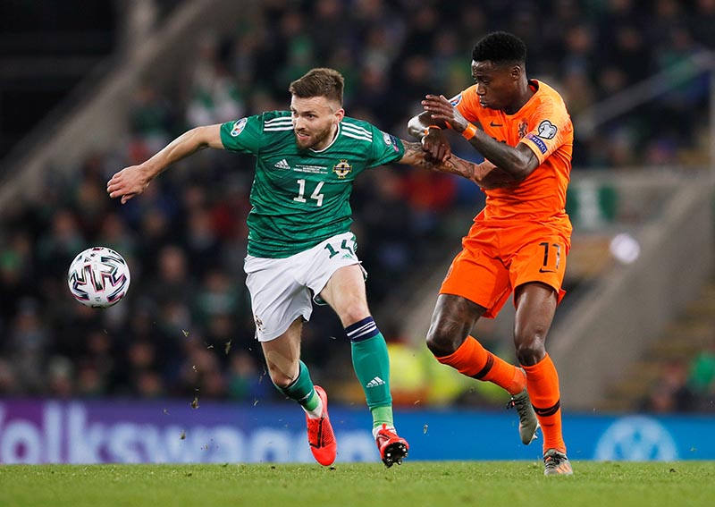 Northern Ireland's Stuart Dallas in action with Netherlands' Quincy Promes during the Euro 2020 Qualifier Group C match between Northern Ireland and Netherlands, at Windsor Park, in Belfast, Northern Ireland, Britain, on November 16, 2019. Photo: Reuters