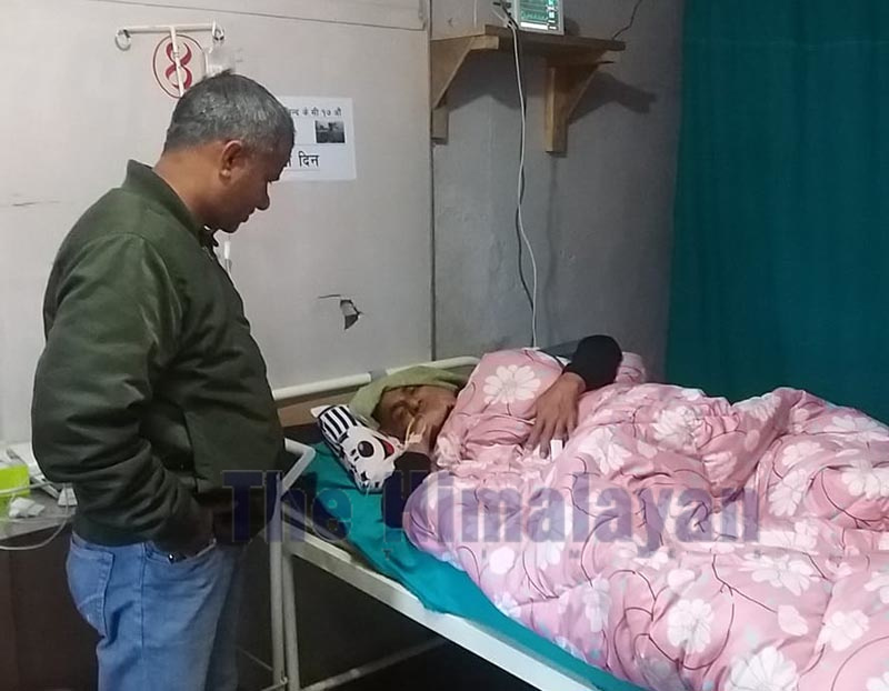 Nepali Congress Dadeldhura President Karna Bahadur Malla visiting Dr Govinda KC, in Dadeldhura Hospital, on Saturday. Photo: THT