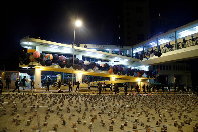 File: Stones are seen scattered on the road to prevent the police from getting to the occupied campus of the Baptist University in Hong Kong, China, November 13, 2019. Photo: Reuters