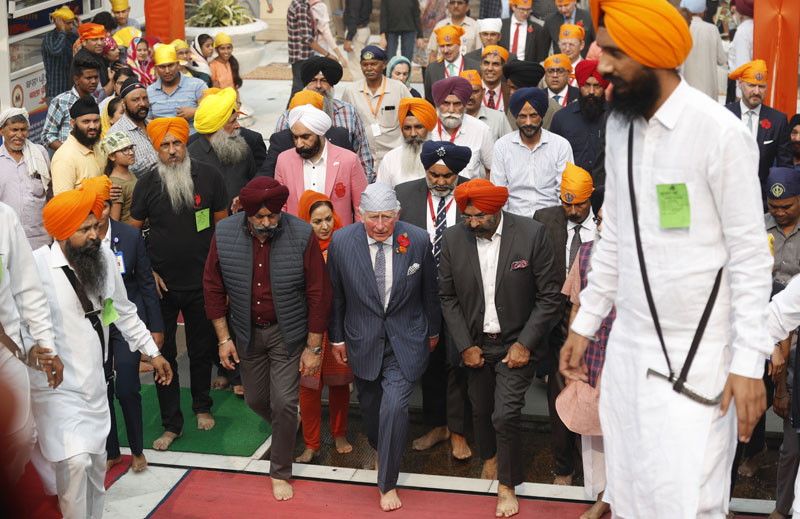Britain's Prince Charles, centre, arrives at Gurudwara Bangla Sahib, a Sikh Temple in New Delhi, India, Wednesday, Nov 13, 2019. Photo: AP
