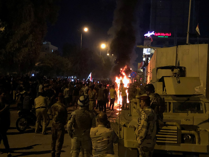 Members of Iraqi security forces are seen in front of the Iranian consulate, as demonstrators gather during ongoing anti-government protests in Kerbala, Iraq November 3, 2019. Picture taken November 3, 2019. Photo: Reuters