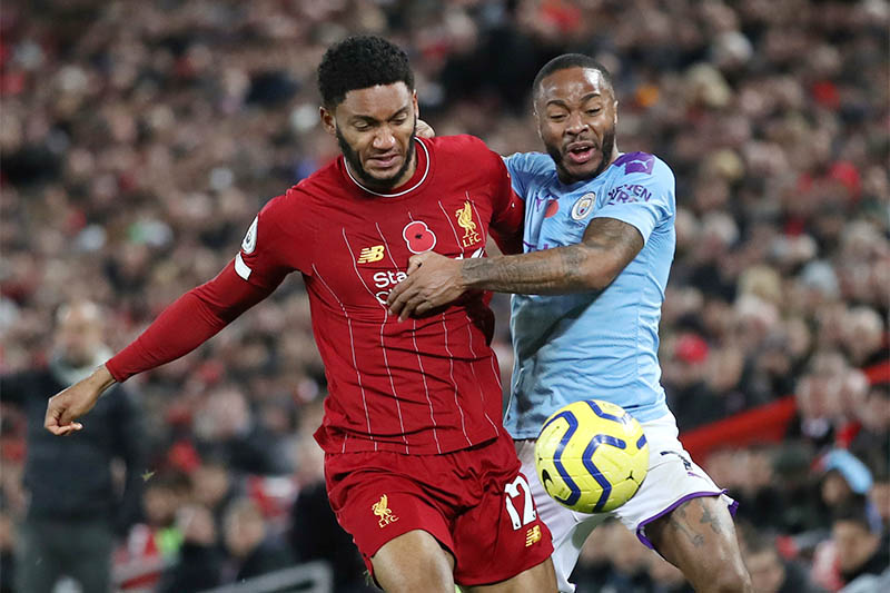 Liverpool's Joe Gomez in action with Manchester City's Raheem Sterling. Photo: Reuters