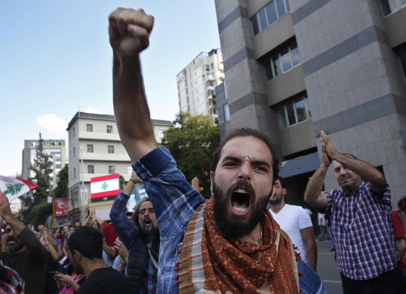 An anti-government protester shots slogans after he was attacked by Hezbollah supporters, in Beirut, Lebanon, Oct 29, 2019. Photo: AP/File