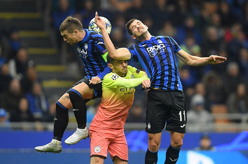 Manchester City's Bernardo Silva in action with Atalanta's Remo Freuler and Alejandro Gomez during the Champions League Group C match between Atalanta and Manchester City, at San Siro, in Milan, Italy, on November 6, 2019. Photo: Reuters