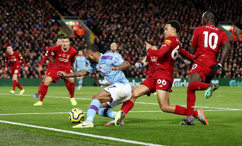 Manchester City's Raheem Sterling in action with Liverpool's Trent Alexander-Arnold during the Premier League match between Liverpool and Manchester City, at Anfield, in Liverpool, Britain, on November 10, 2019. Photo: Action Images via Reuters