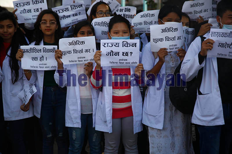 Medical students protesting against extra fee charged by medical colleges, at Maitighar Mandala, in Kathmandu, on Tuesday. Photo: Skanda Gautam / THT