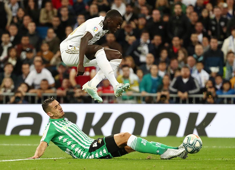 Real Madrid's Ferland Mendy in action with Real Betis' Zouhair Feddal during the La Liga Santander match between Real Madrid and Real Betis, at Santiago Bernabeu, in Madrid, Spain, on November 2, 2019. Photo: Reuters