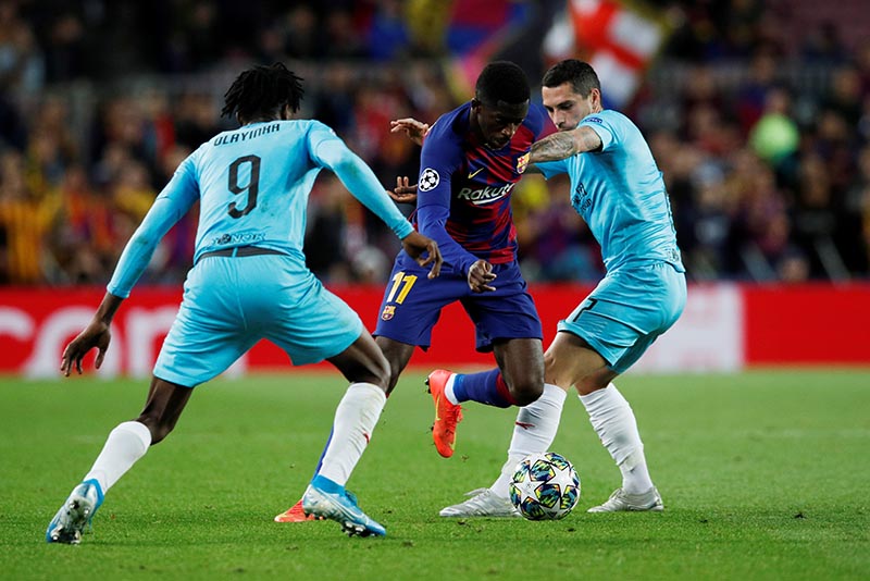 Barcelona's Ousmane Dembele in action with SK Slavia Prague's Peter Olayinka and Nicolae Stanciu during the Champions League  Group F match between FC Barcelona and SK Slavia Prague, at Camp Nou, in Barcelona, Spain, on November 5, 2019. Photo: Reuters