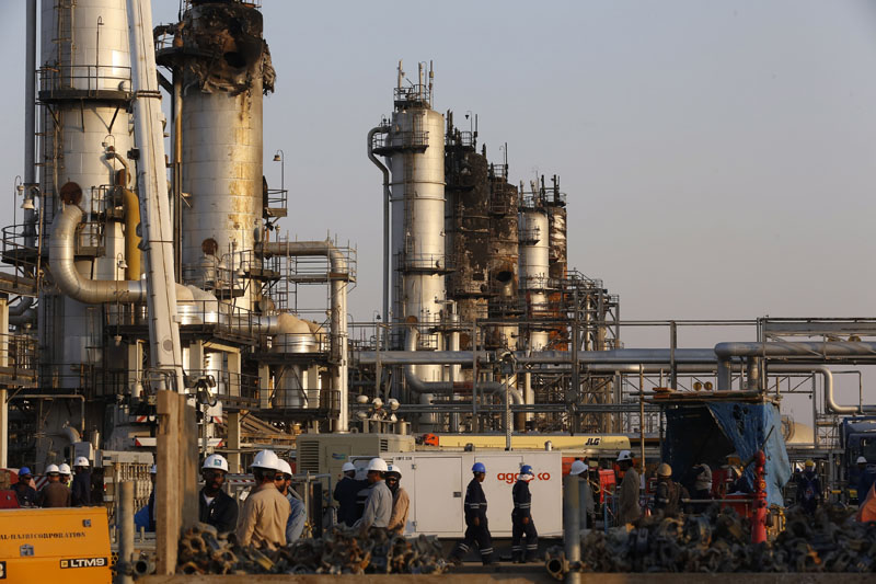Workers fix the damage in Aramco's oil separator at processing facility after the recent Sept 14 attack in Abqaiq, near Dammam in the Kingdom's Eastern Province, Sept 20, 2019. Photo: AP/File