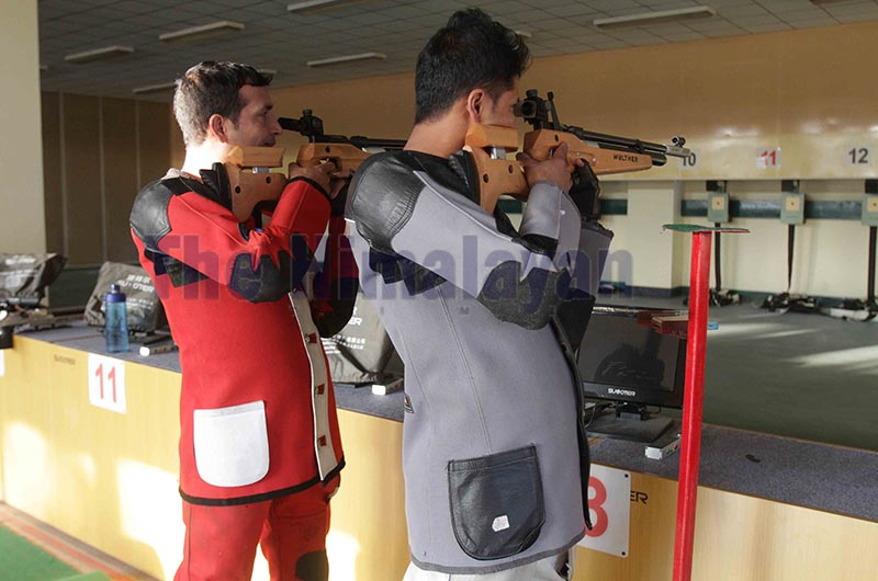 Shooters wearing thier old gears and aiming targets with old version of air rifle while practicing 10 meters air rifle at shooting range of International Sports Complex, Satdobato in Lalitpur on Thursday. Photo: Udipt Singh Chhetry/ THT