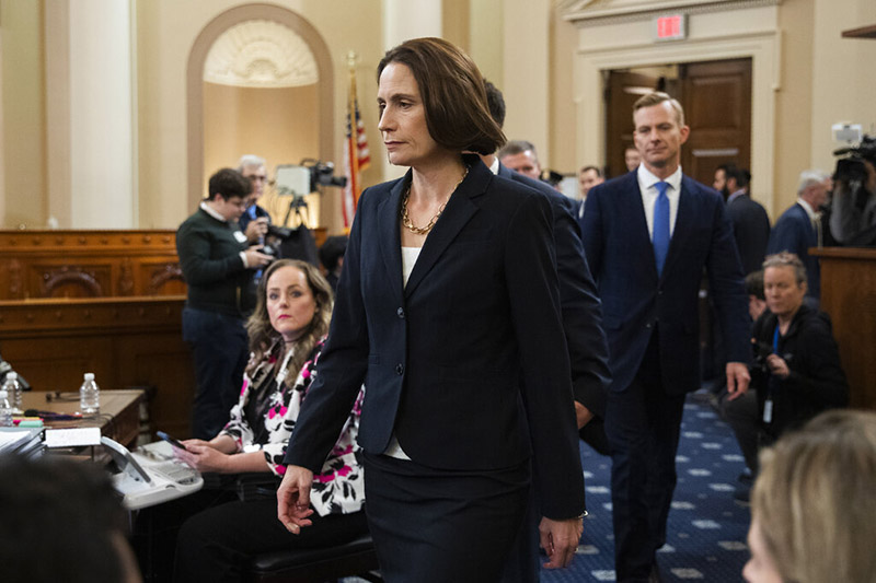 Former White House national security aide Fiona Hill, and David Holmes, a US diplomat in Ukraine, back right, walk to their seats to testify before the House Intelligence Committee on Capitol Hill, in Washington, Thursday, November 21, 2019, during a public impeachment hearing of President Donald Trump's efforts to tie US aid for Ukraine to investigations of his political opponents. Photo: AP