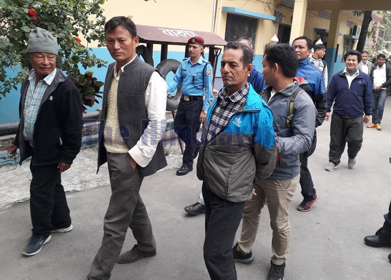 Police taking the arrested to the district court for remand after they tried to influence people to boycott the upcoming by-election, at Chhata Chowk in Dharan, on Monday, November 26, 2019. Photo: THT