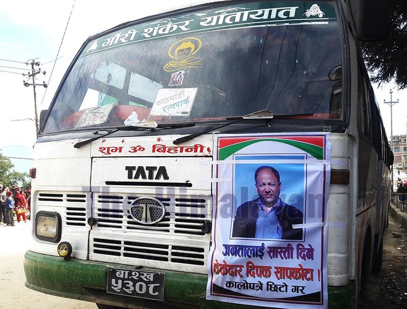 A poster of Sunaulo Khimti JV Manager Dipak Sapkota pasted on a bus to press the contractor to complete road construction in Budhe, Dolakha, on Saturday. Photo: THT