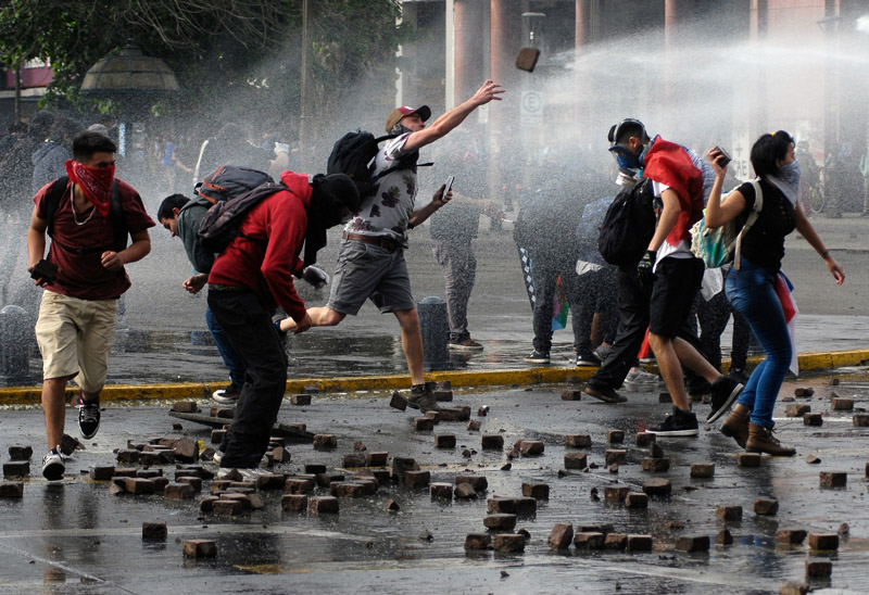 Demonstrators throw stones during a protest against Chile's government  in Concepcion, Chile November 7, 2019. Photo: Reuters