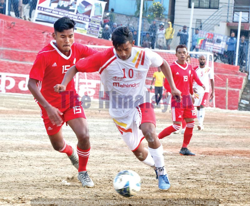APFu2019s Rajiv Lopchan (right) vies for the ball with Sankatau2019s nRoman Limbu during their third Chandragiri Mayor Gold nCup Football Tournament match in Naikap on Tuesday, November 19, 2019. Photo: THT