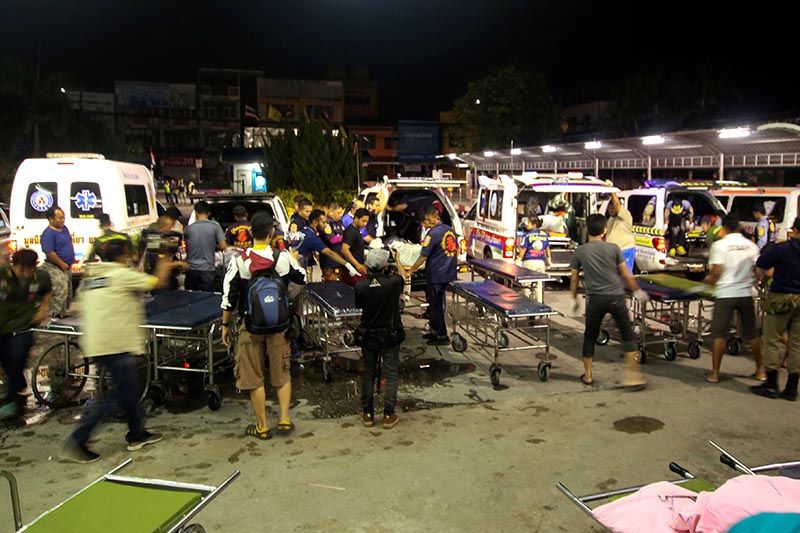 Rescue workers transfer the bodies of dead village defence volunteers, who were killed by suspected separatist insurgents, to stretcher trolleys at a hospital in Yala province, southern Thailand, November 6, 2019. Photo: Reuters