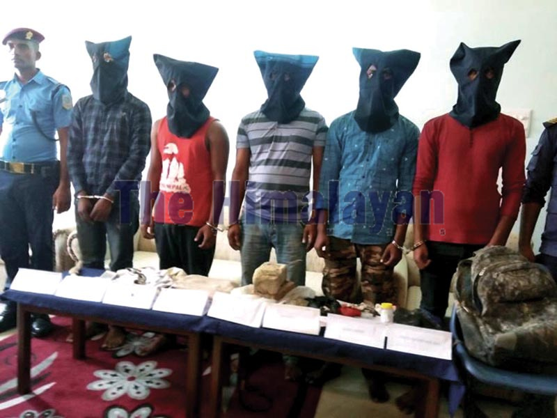 Police making public five persons arrested on the charge of murder at District Police Office, Siraha, on Monday. Photo: THT