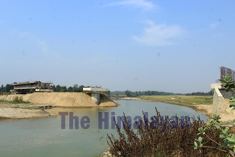 The Mohana-Rajghat bridge that has been under construction for six years, over Mohana River, in Kailali district, as pictured on Friday, November 22, 2019. Photo: Tekendra Deuba/THT