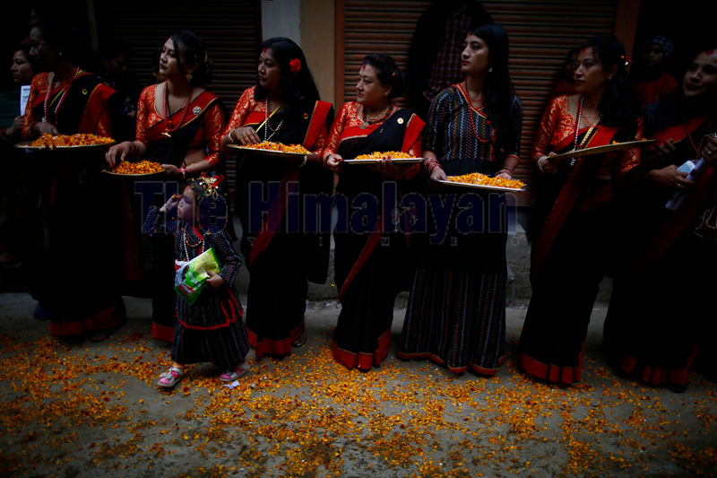 Women dressed in traditional attires participate in a parade observing Ya:mari Punhi festivities in Kathmandu, on Thursday, December 12, 2019. Photo: Skanda Gautam/THT
