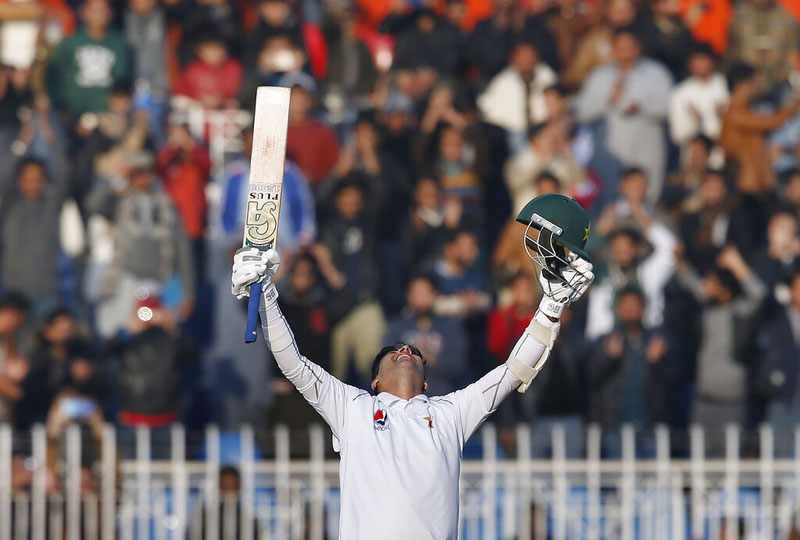 Pakistani batman Abid Ali celebrates after completing his century during the fifth-day of the 1st cricket test match between Pakistan and Sri Lanka, in Rawalpindi, Pakistan, Sunday, December 15, 2019. Photo: Reuters