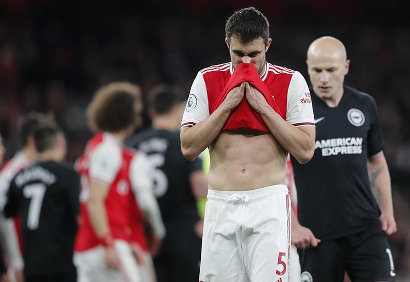 Arsenal's Sokratis Papastathopoulos wipes his face during the English Premier League soccer match between Arsenal and Brighton, at the Emirates Stadium in London, on Thursday, December 5, 2019. Photo: AP