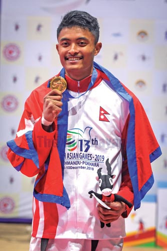 Bhupen Shrestha celebrates after winning gold medal in taekwondo under the 13th South Asian Games on Thursday, December 5, 2019. Photo: THT