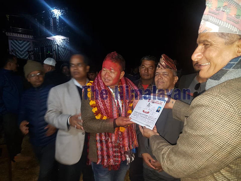 Nabin Kumar Shrestha of Nepal Communist Party (NCP) receives certificate after winning the post of ward chair of Sundar Bazaar Municipality-2, Lamjung, on November 30, 2019. Photo: Ramji Rana/THT